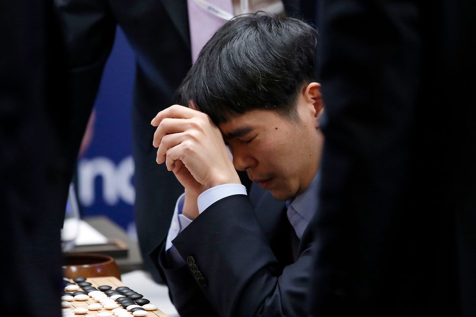 Lee Sedol despairing during his match against AlphaGo in 2016