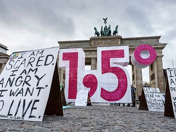 The number 1.5 in front of the Berlin Brandenburger Tor during a protest march