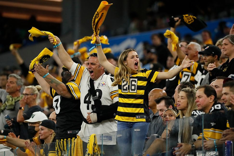 Enthusiastic fans are supporting their American Football team.