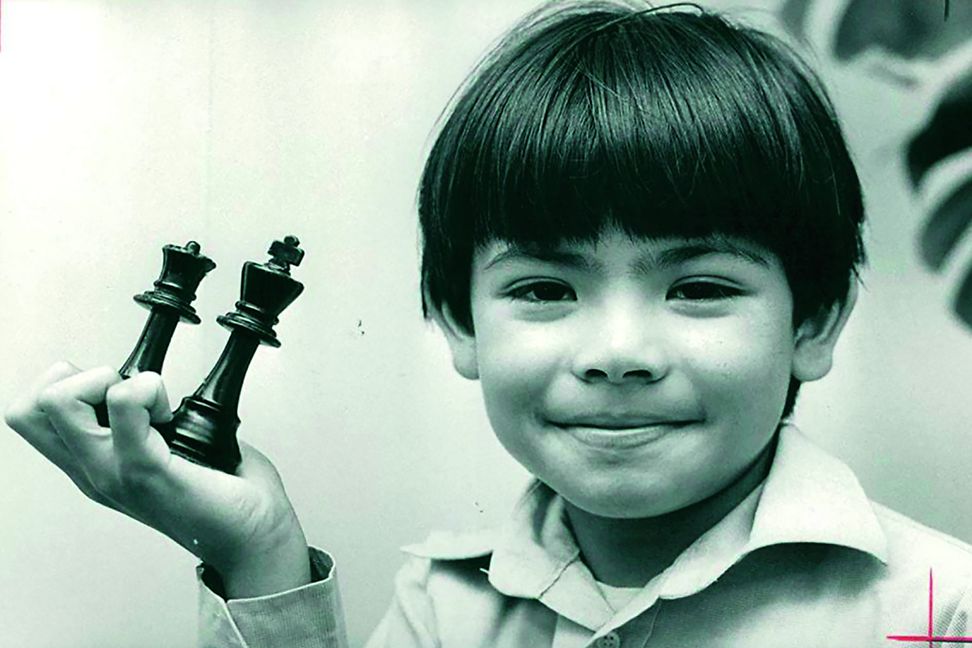 Demis Hassabis as a child with a chess set 