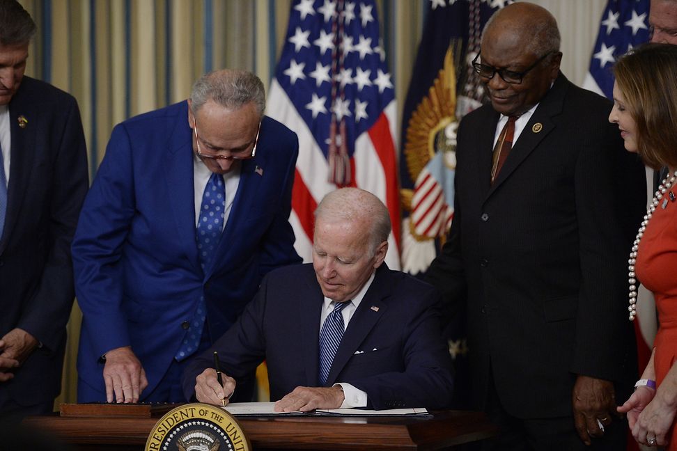 US President Joe Biden signs the Inflation Reduction Act of 2022, a USD 737 billion act focused on lowering healthcare costs