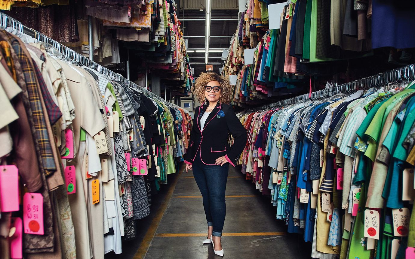 Ruth Carter in front of many clothes