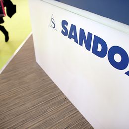 A stand adorned with Sandoz' logo