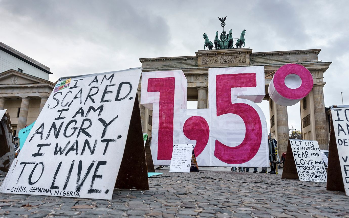 The number 1.5 in front of the Berlin Brandenburger Tor during a protest march