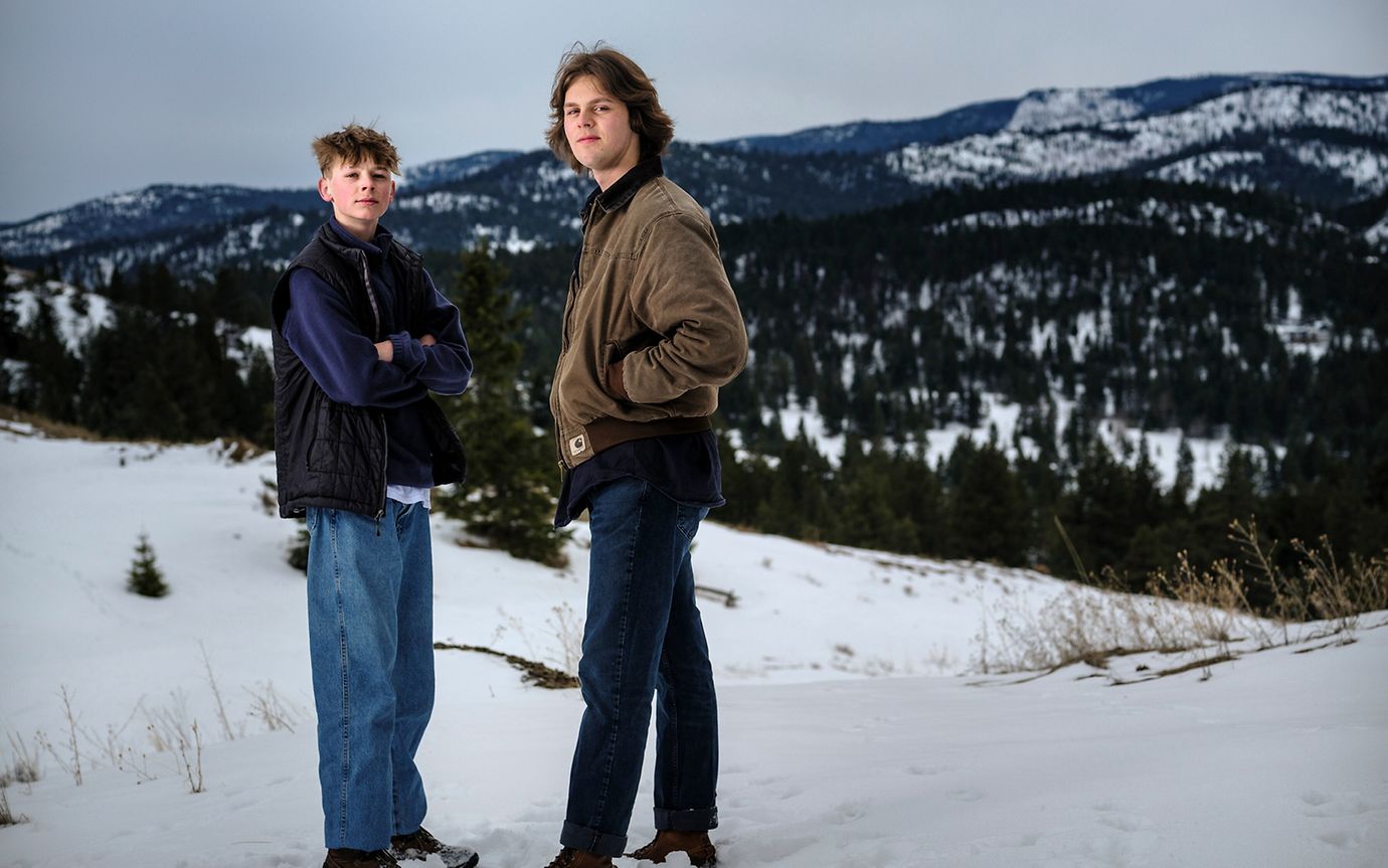 Two teenagers facing the camera in snowy Montana