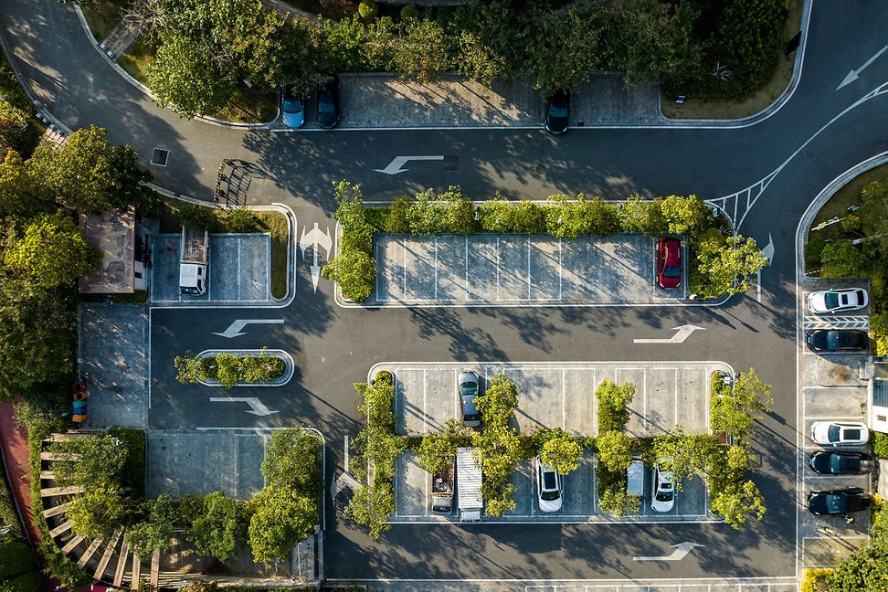 Aerial view of a car park in an urban green belt