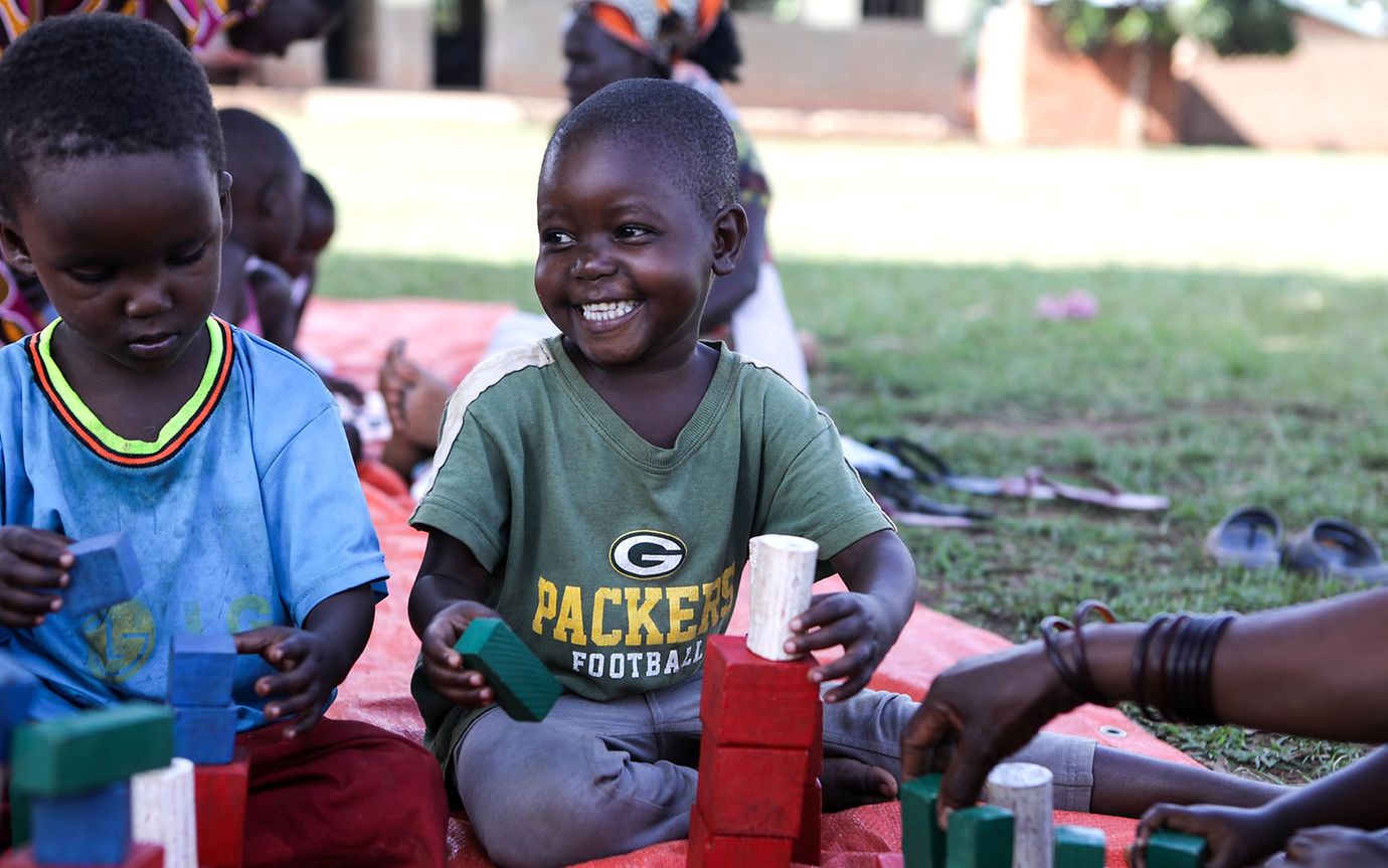 Child smiles happily during play