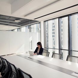 Individual employee in a modern meeting room