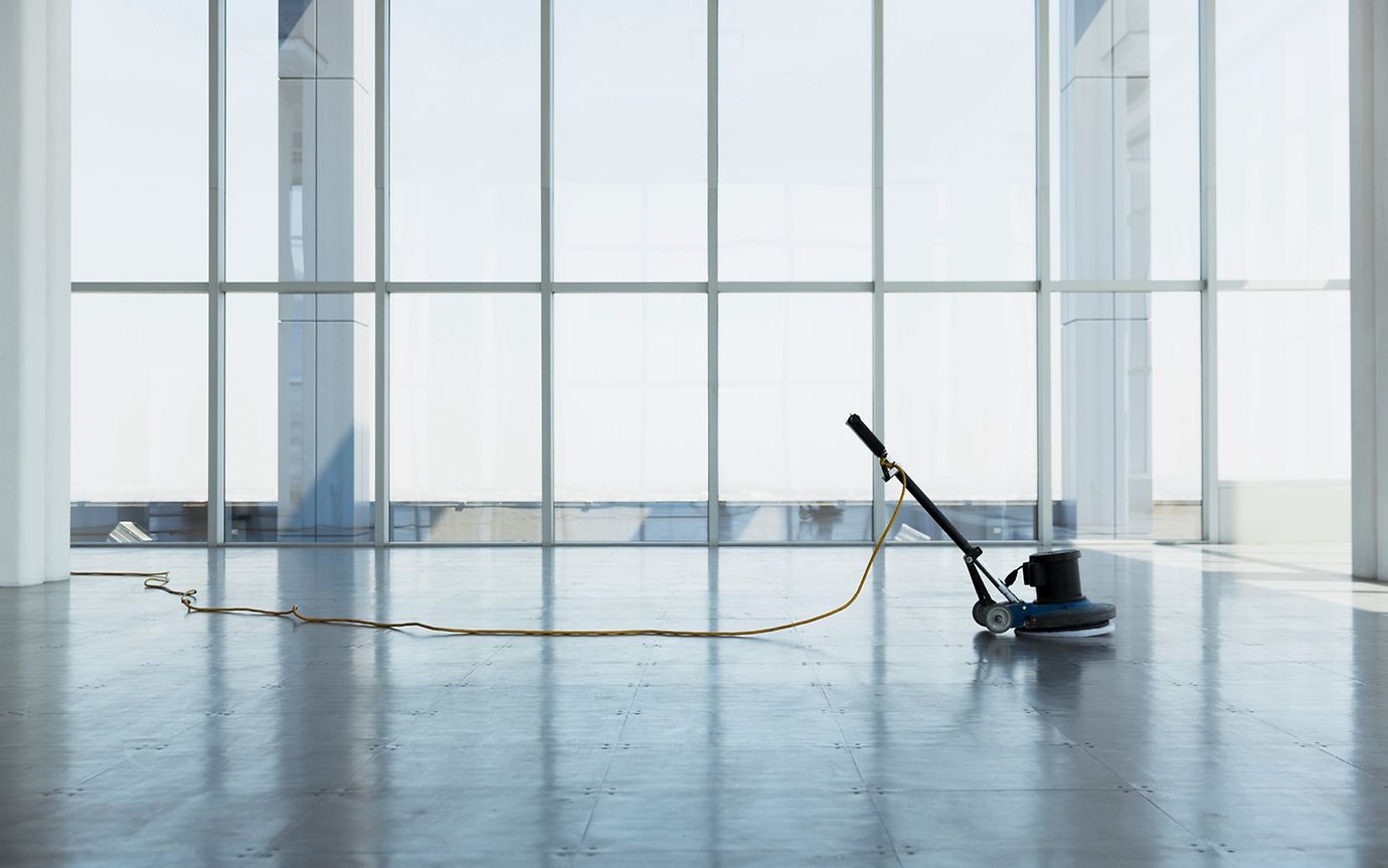 Vacant office space with cleaning machine