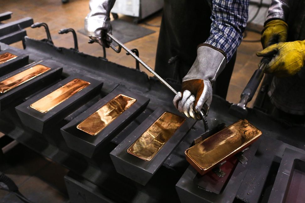 Gold moulded into bars in a refinery