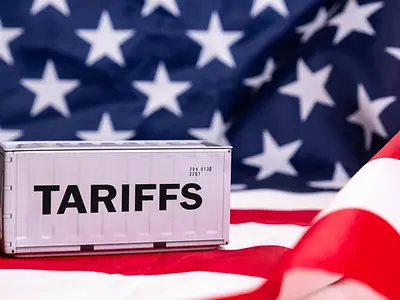 The word tariffs with an American flag